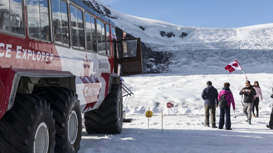 A giant Ice Explorer transports visitors to the Athabasca Glacier.