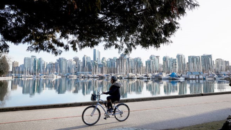 Biking is a favourite way to explore Vancouver’s Seawall, and its most famous green space, Stanley Park.]