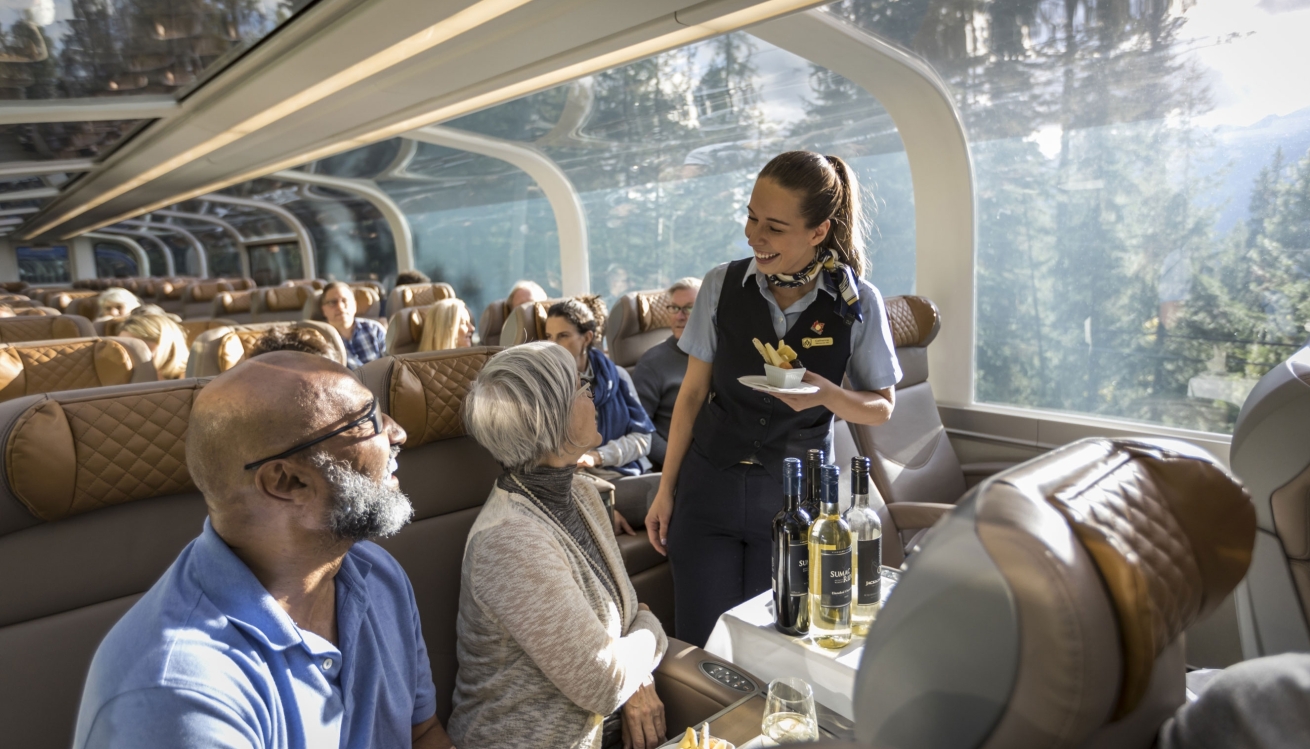 Indulge your senses with gourmet meals and expansive views through a bi-level glass dome coach to the Canadian Rockies.
