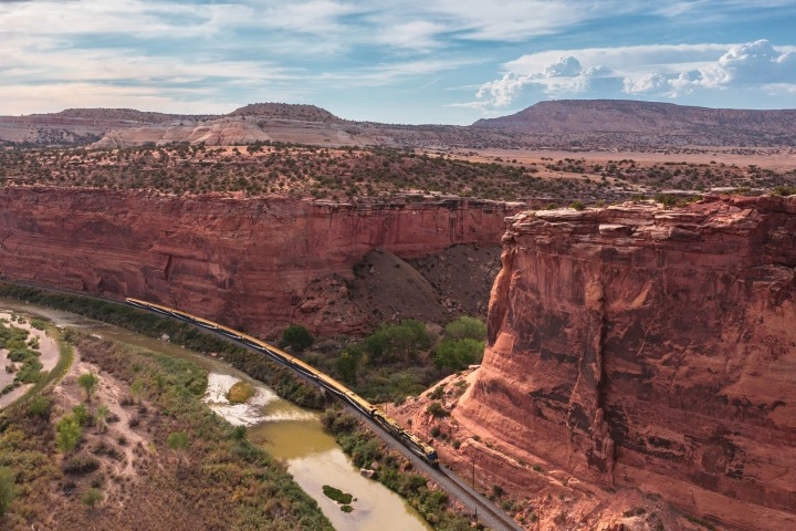 Train passing through Ruby Canyon on the Rockies to the Red Rocks route