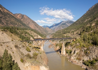 Rocky Mountaineer train travelling over the Fraser River Bridge, British Colombia